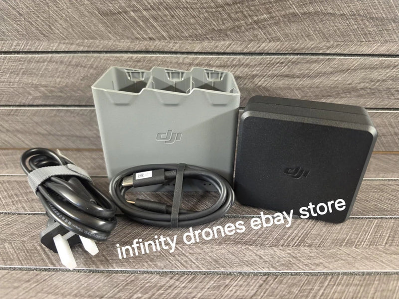 DJI Mini 5 Pro charging station with power adapter and cable, compact gray