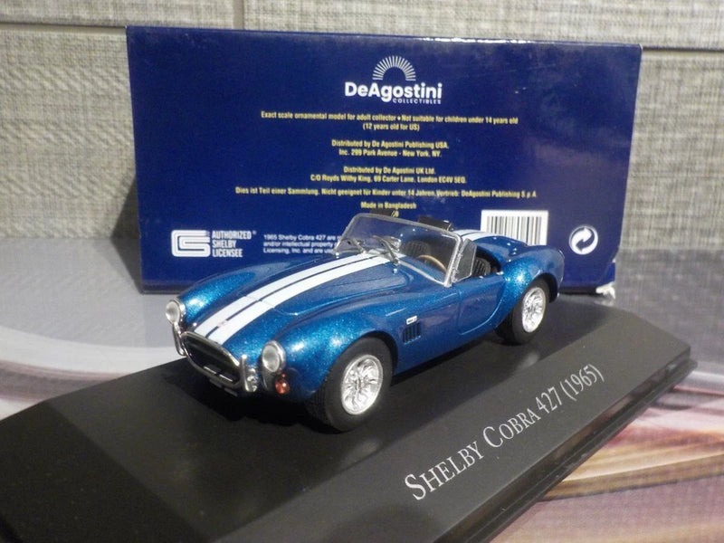 Blue Shelby Cobra 427 1965 model car with chrome details on display base