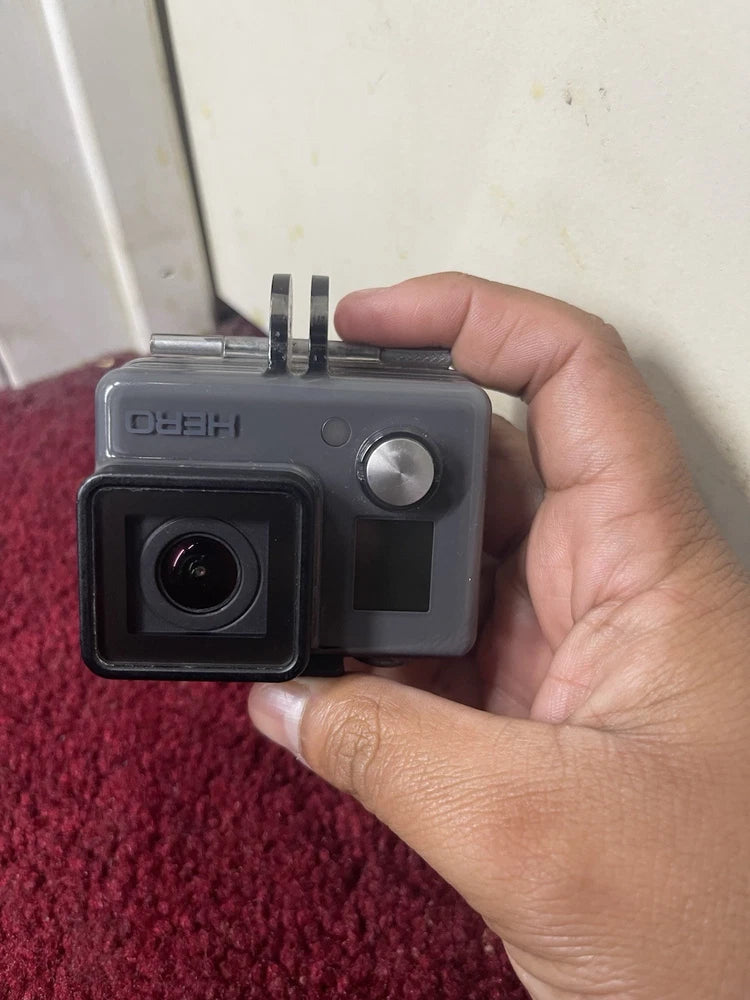 Used GoPro HERO+ action camera with front lens and side control buttons, gray body