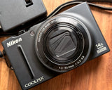 Nikon COOLPIX S8200 compact digital camera with wide optical zoom lens, front view