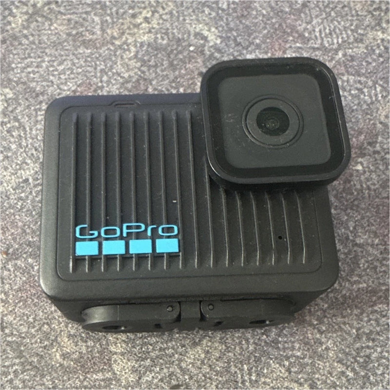 GoPro black action camera with front lens and blue logo, rugged housing