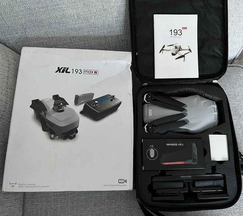 Foldable drone and accessory kit in a hard-shell carrying case