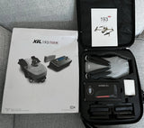 Foldable drone and accessory kit in a hard-shell carrying case