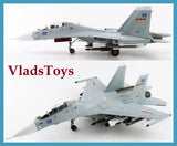 Gray fighter jet model aircraft with blue 08 markings and mounted missiles