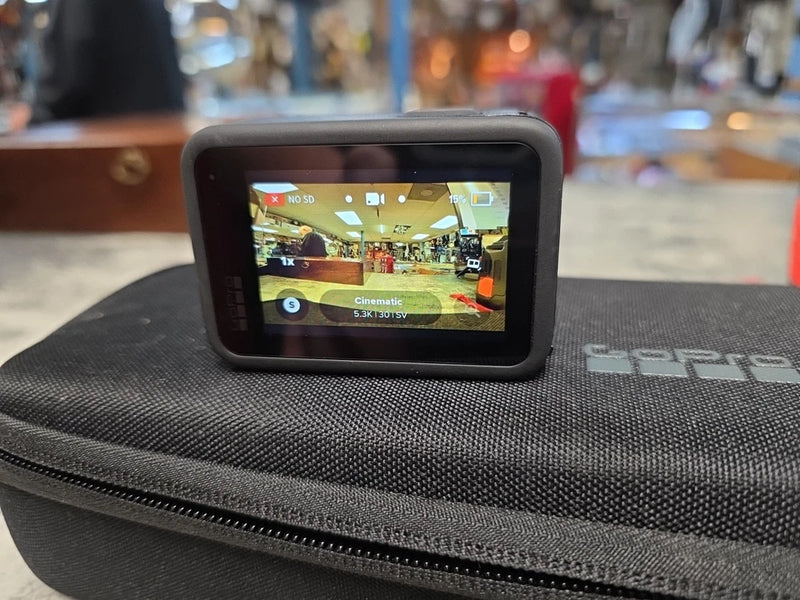 GoPro action camera with rear screen in black padded case with zipper