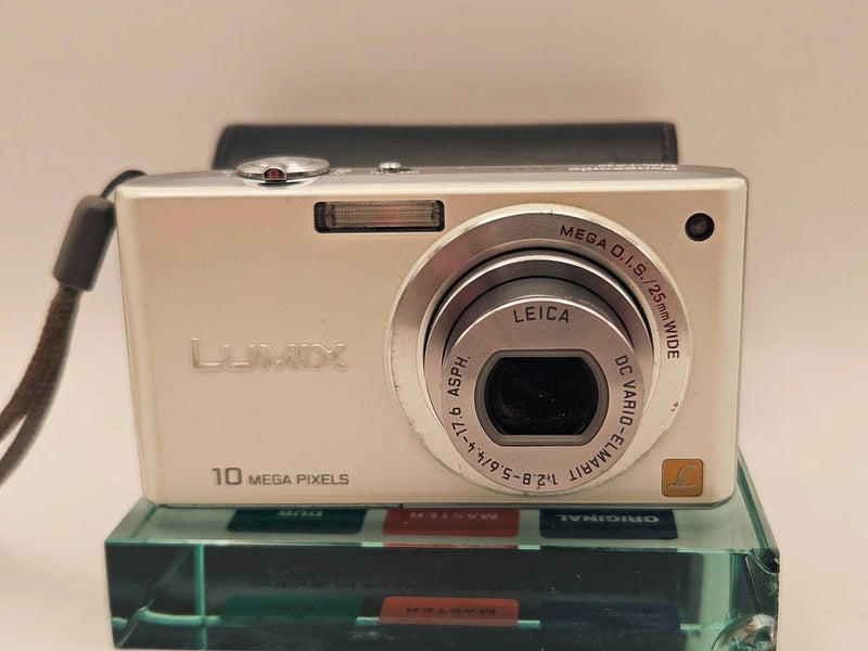 Silver Panasonic Lumix compact digital camera with lens and top controls
