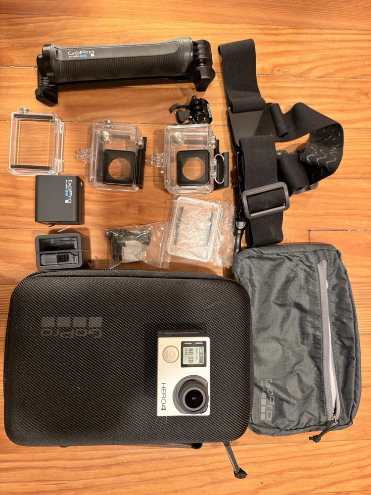 GoPro HERO4 action camera bundle with camera case, waterproof housings, and chest strap