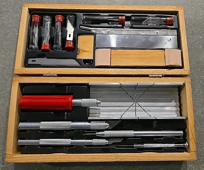 Wooden modeler tool chest with hobby knives, blades, and sanding blocks