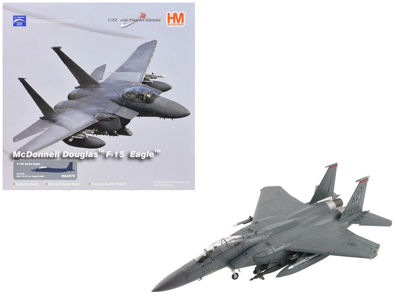 Gray F-15E Strike Eagle fighter jet model with swept wings, viewed from side