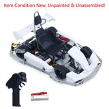 RC racing kart model kit with white chassis, transmitter, and steering/battery components