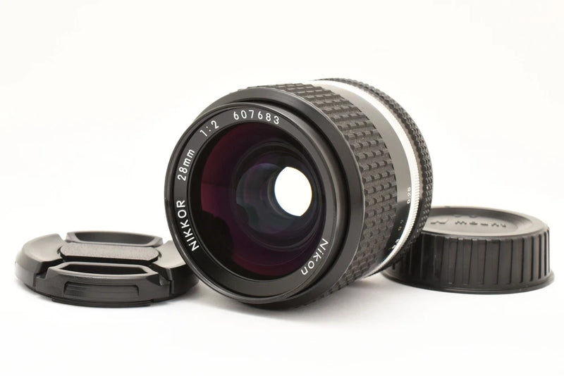 Nikon Ai-s 28mm f/2 wide-angle prime lens with front glass and caps