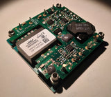 Isolated DC-DC converter module with green PCB, ICs, and terminal posts on corners