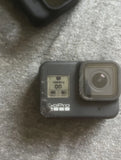 GoPro Hero 8 camera with rear screen and side lens housing, dark gray/black