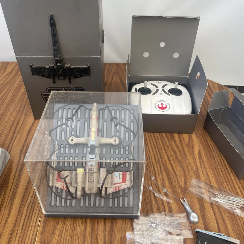 Propel quadcopter drone with parts in clear box, controller included