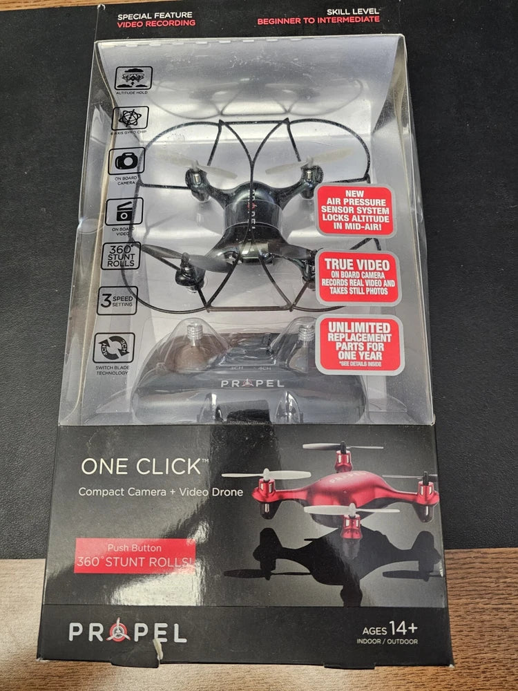 Propel compact camera video drone in retail box, red quadcopter with camera