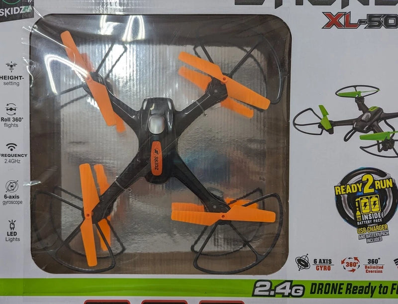 Orange and black RC quadcopter drone with 4 propellers, in retail box packaging