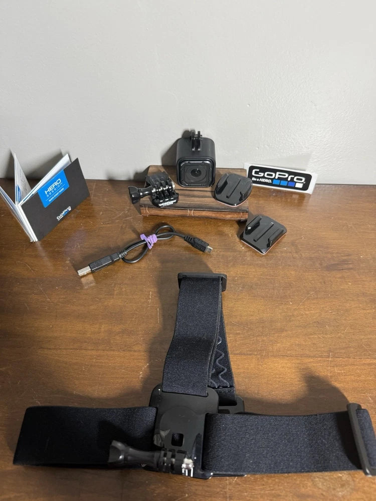 Black GoPro action camera with multiple mounts and protective case
