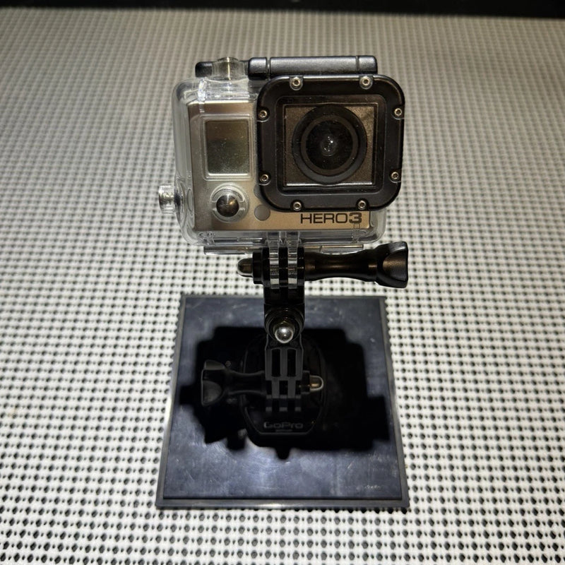 GoPro action camera in clear waterproof housing with black mount base