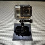 GoPro action camera in clear waterproof housing with black mount base