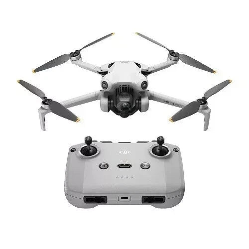 Foldable camera drone with four propellers and front camera, plus white remote controller