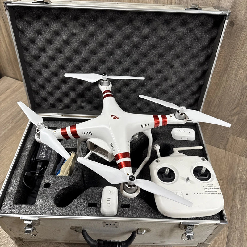 White quadcopter drone with red stripes and remote controller in hard case