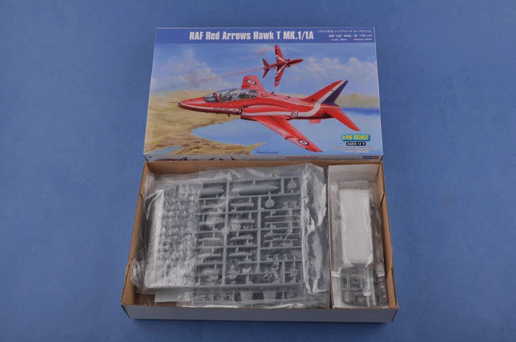 Scale aircraft model kit box with red Hawk artwork and gray plastic sprue parts