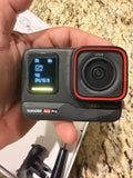 Insta360 Ace Pro action camera with front lens and display screen in dark gray