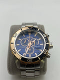 Men's quartz chronograph wristwatch with blue dial, gold bezel, steel bracelet