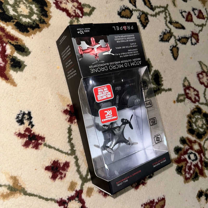 Wireless micro quadcopter drone in retail box, with small four-blade propellers