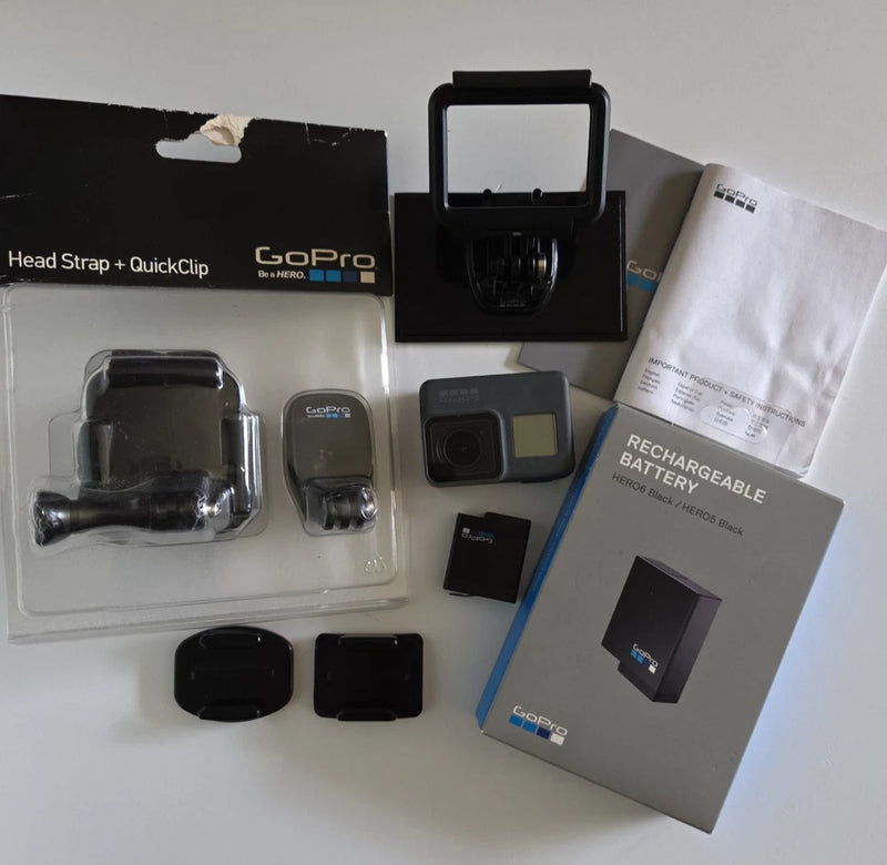 GoPro Hero 5 Black action camera kit with head strap, mounting parts, spare rechargeable battery