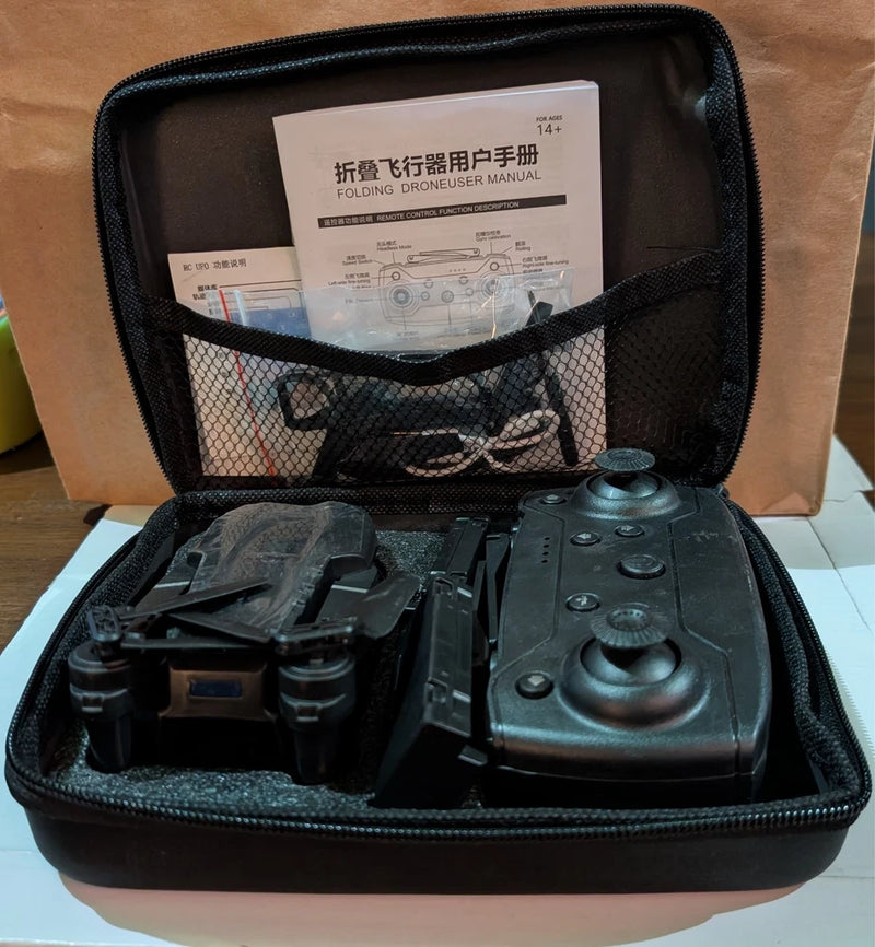 Foldable quadcopter drone and controller in hard zip case, dark gray/black