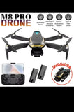 Foldable quadcopter drone with front camera, four propeller arms, dark gray body