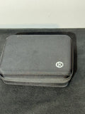 Gray waterproof camera case with textured fabric and round logo