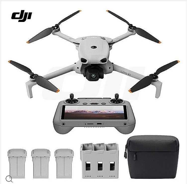 DJI drone with controller, four propellers, battery packs, and carrying case