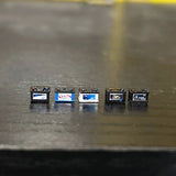 Mini resin model car batteries with painted labels in small scale