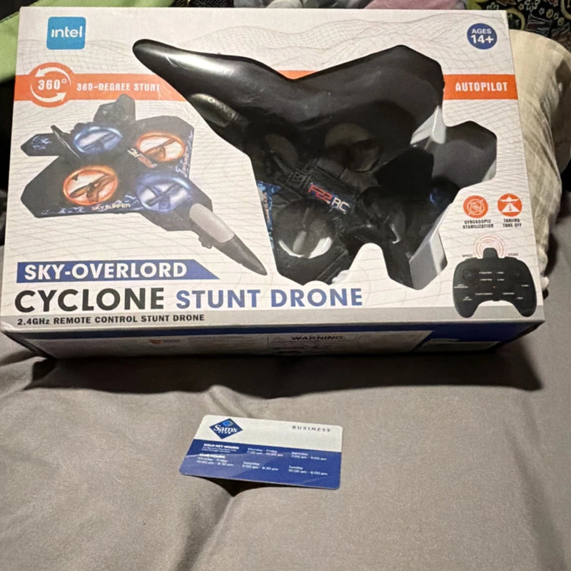 Black RC quadcopter stunt drone in retail packaging box
