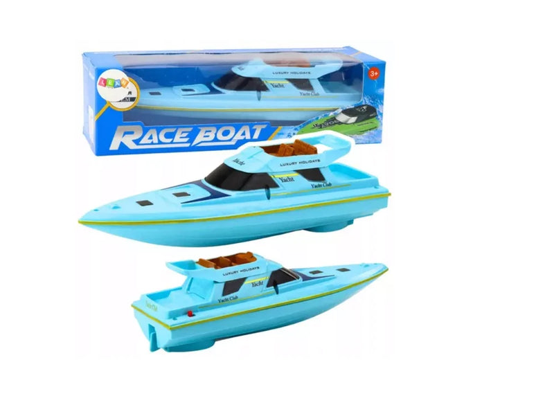Blue toy race boat with black accents, shown with retail box packaging