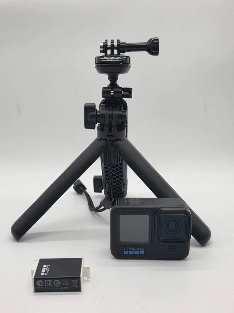 GoPro HERO11 Black action camera on compact tripod, front screen and lens visible