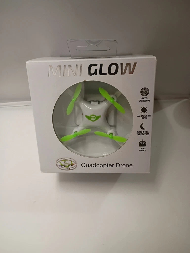 Mini glow quadcopter drone box with clear window and green propellers