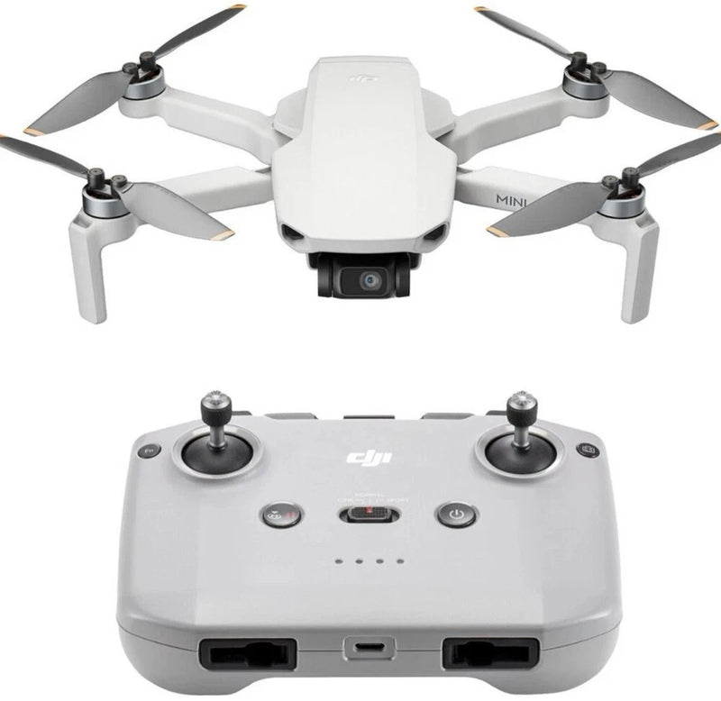 White quadcopter drone with built-in camera and gray remote controller