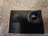 Black 1080P HD action camera with wide-angle lens and power button
