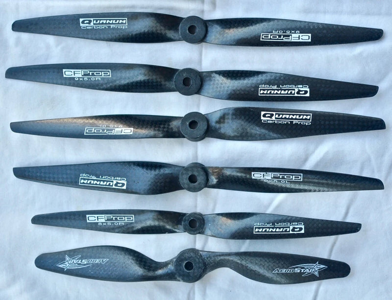 Assorted drone replacement propeller blades, six hub-mounted pieces, dark carbon-look