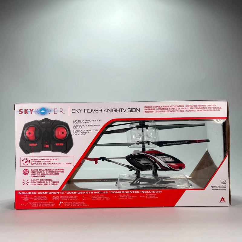 Indoor helicopter drone in retail box with red-and-black rotor and handheld controller