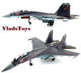 Gray Su-35S fighter jet model with red '04' markings, open landing gear and twin wings