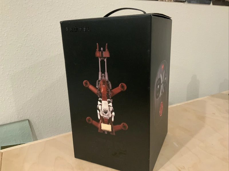 Black Propel drone packaging box with red 74-Z speeder bike artwork