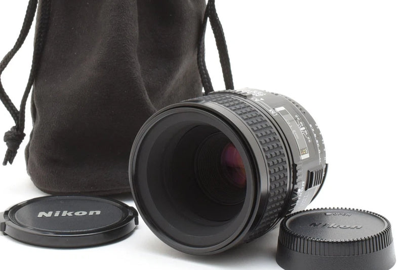 Nikon AF Micro Nikkor 60mm f/2.8 macro lens with front and rear caps, in pouch