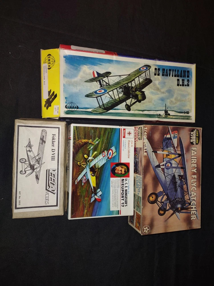 Set of 4 vintage model airplane hobby kit boxes with illustrated aircraft and parts