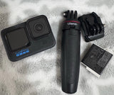 GoPro HERO8 Black action camera with handle grip, mount, and battery