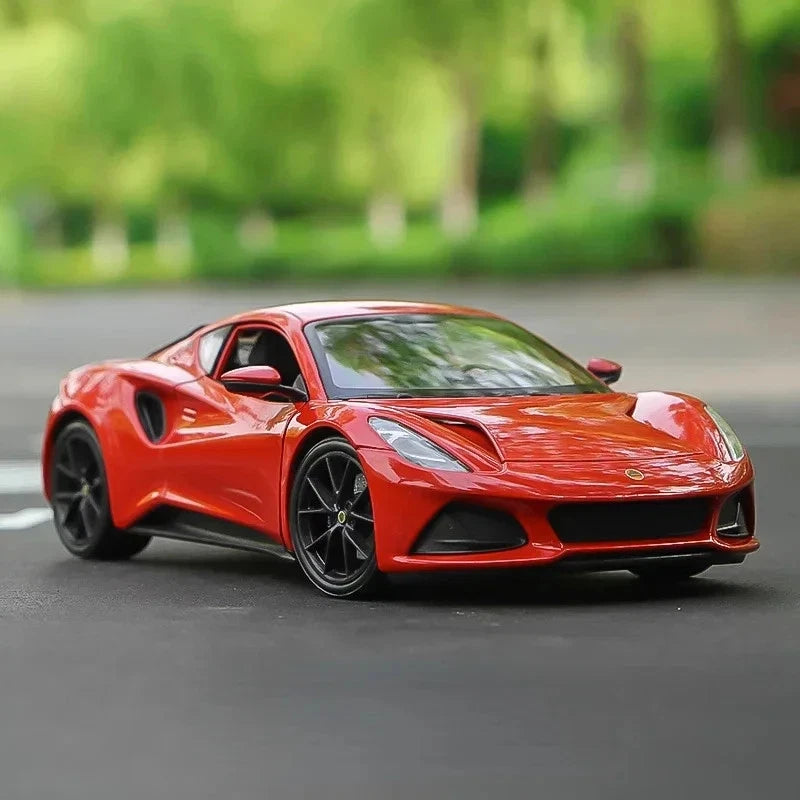 WELLY 1:24 Lotus Emira die-cast-style sports car model, orange front three-quarter