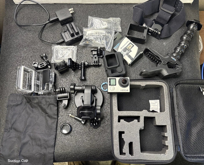 GoPro HERO4 Session action cam with multiple mounts, suction cup, and hard case